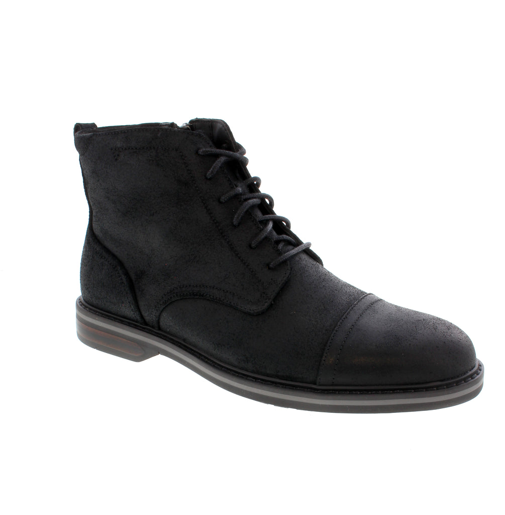Timeless sophistication meets everyday comfort in the Clarks Aldwin 2 Cap. This classic ankle boot features a refined suede upper with a distinctive cap toe, designed for those who appreciate quality craftsmanship and understated elegance. Premium suede upper with leather and microfiber lining for breathability and durability. Cushioned microfiber footbed and foam midsole provide all-day comfort.