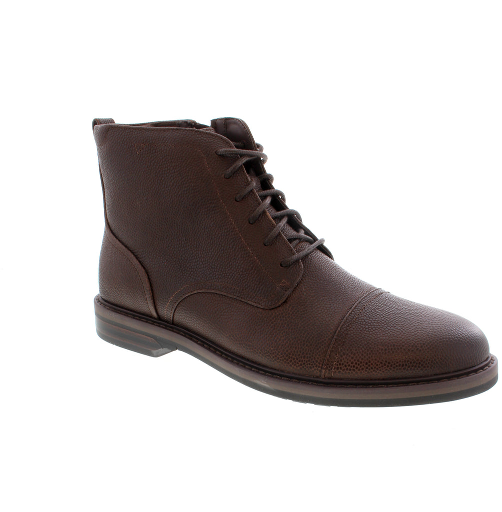 Timeless brown leather cap-toe boot that transitions seamlessly from office to weekend. The Clarks Aldwin 2 Cap combines classic styling with everyday comfort. Leather upper and lining with a supportive microfiber footbed. Foam midsole and rubber outsole provide cushioning and durability. Lace-up entry for a secure fit. Fits true to size with average width and instep. Reinforced arch support for all-day wear. Less than 1" stacked heel with almond and cap toe styling.