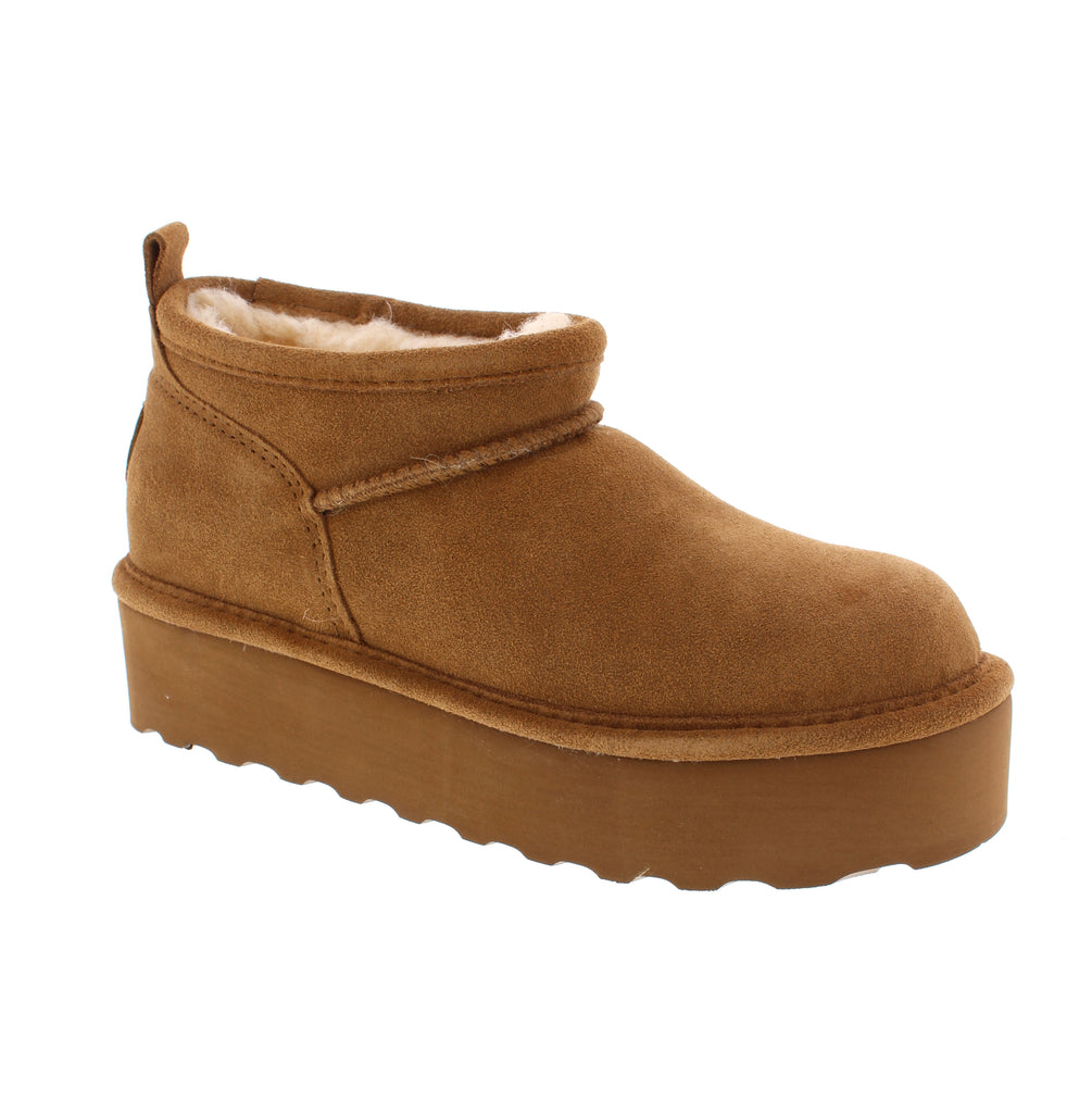 Step back in time with the Bearpaw Retro Super Shorty in Hickory. Featuring a lightweight 1.5” platform heel, these boots blend vintage flair with modern comfort. Designed to protect your feet during winter while elevating your style, they offer a versatile look that suits trends from the 70’s, 90’s, and today. Perfect for those seeking both function and fashion in one timeless design.