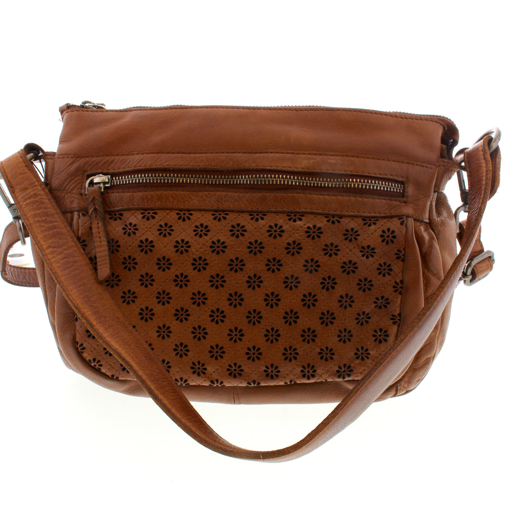 This functional and sophisticated bag from The Trend is ideal for any event. Boasting a perforated floral pattern, numerous zippered compartments, and an adjustable strap, this bag is the ultimate pick for fashion on the go.