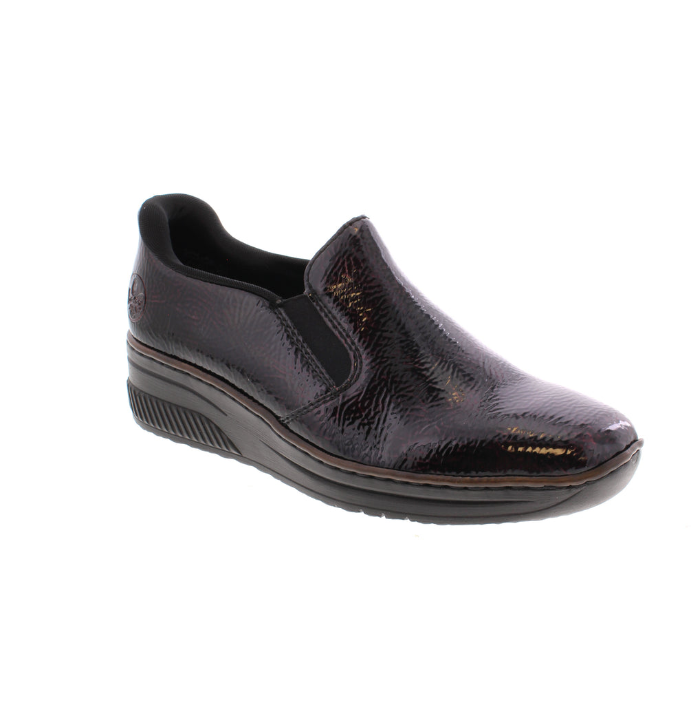 Step confidently with the Rieker 48761-35, combining style, comfort, and durability. Its stitchdown construction ensures flexibility and strength, while the elastic band guarantees a snug, glove-like fit. The lightweight wedge heel sole absorbs shock, providing lasting comfort with every step. Plus, the extra-soft cover sole enhances your walking experience, making these shoes a perfect blend of function and fashion.