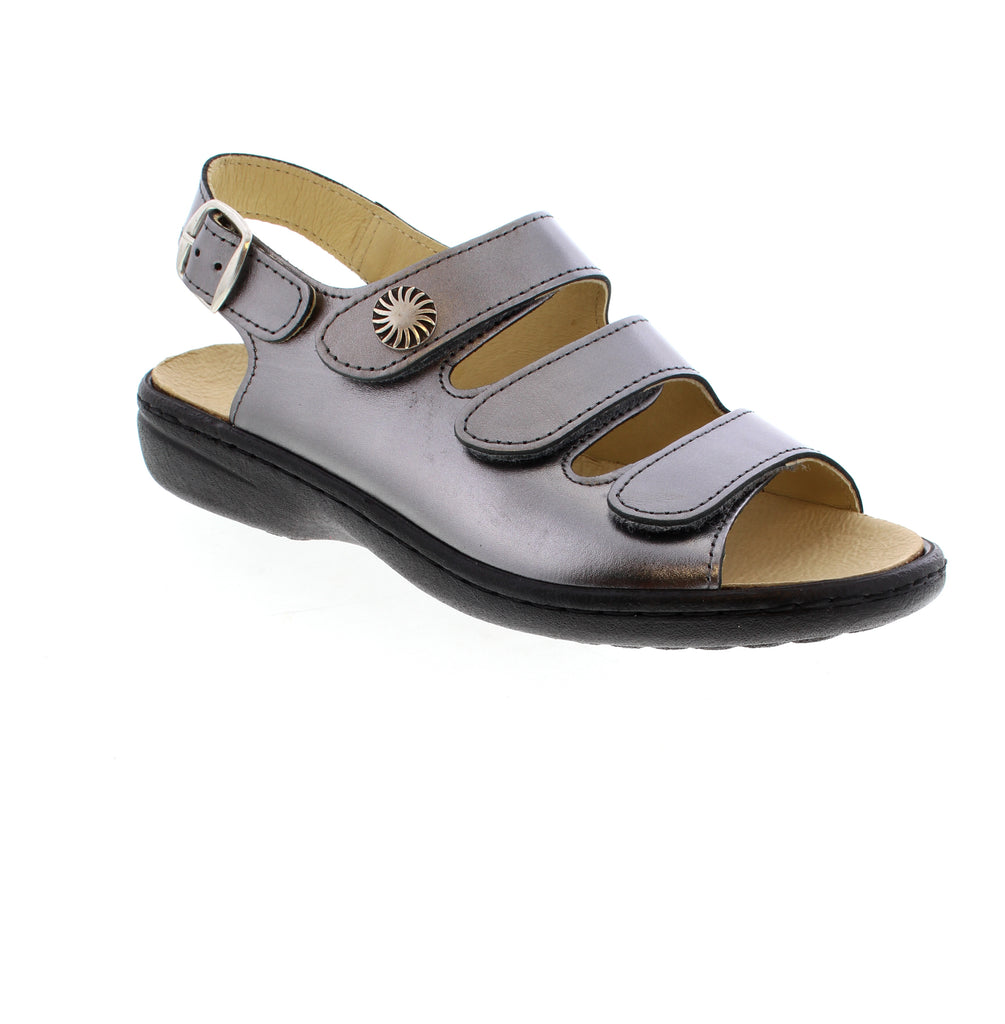 Volks Walkers 50252-SILVER metallic leather sandal with round toe and sculpted heel under 1". Triple closure system with velcro, buckle, and back strap for secure fit. Cork midsole with removable leather insole. Orthotic-friendly and true to size for narrow-medium feet. Rubber outsole perfect for casual summer wear