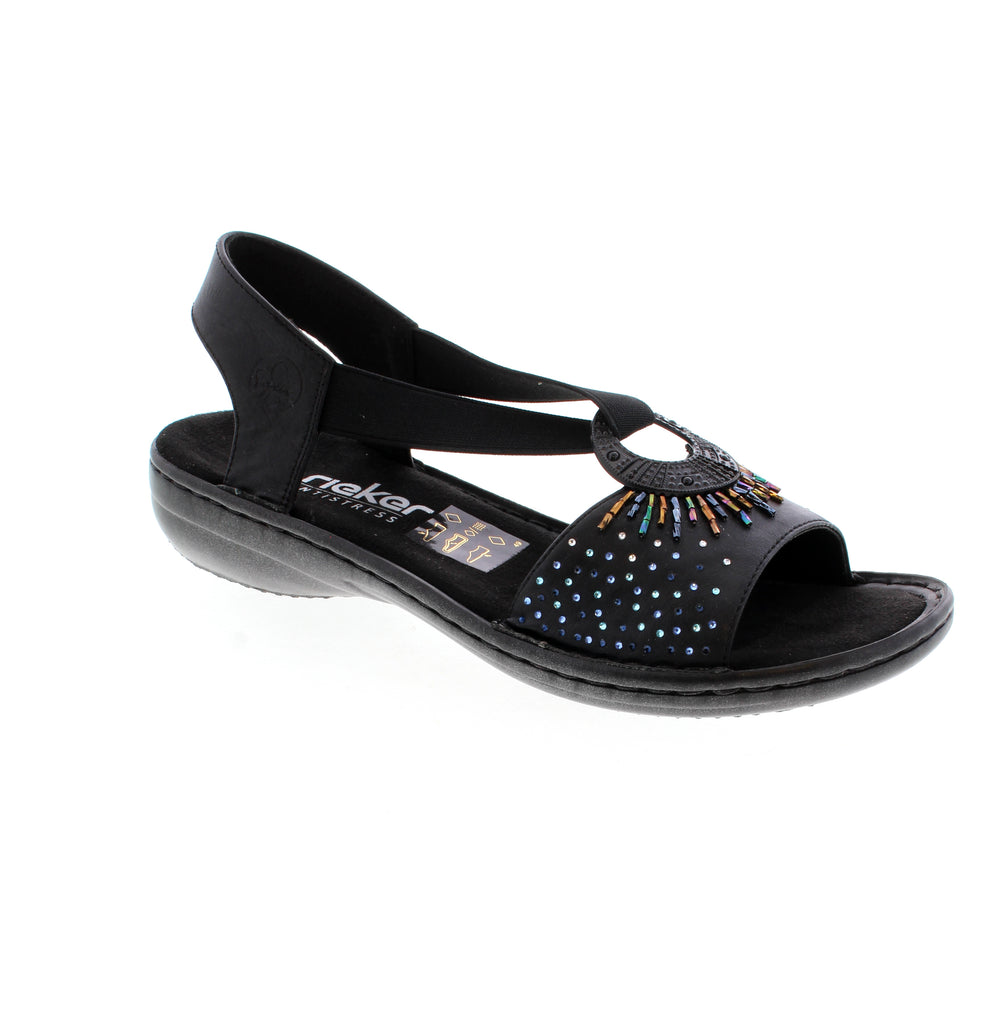 The 60880 sandal by Rieker features an elastic insert for comfort and easy wear. The rhinestone accents will elevate your outfit.