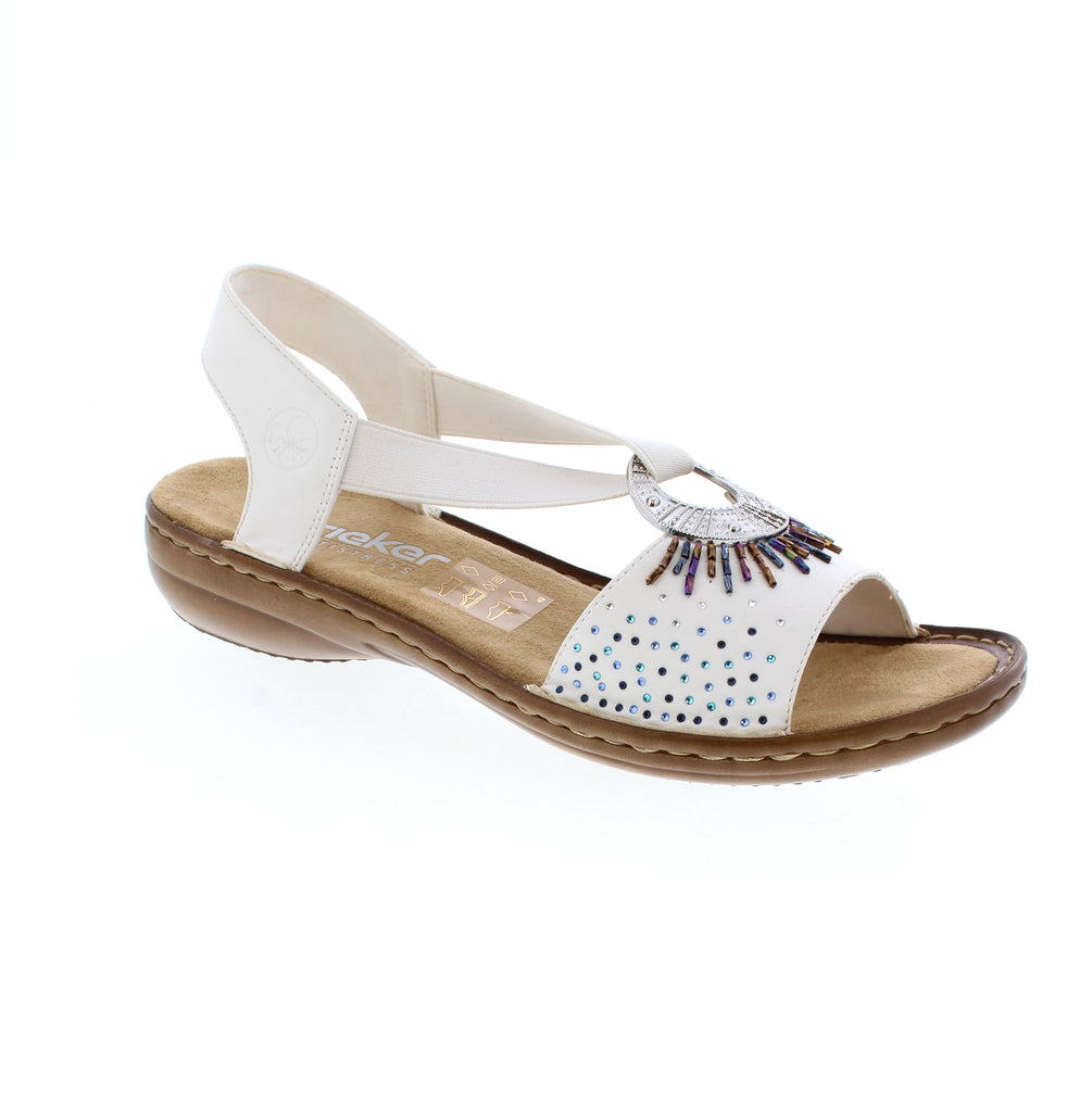 The 60880 sandal by Rieker features an elastic insert for comfort and easy wear. The rhinestone accents will elevate your outfit.