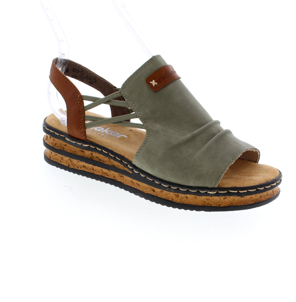 Step into the Rieker 62962-52 slingback sandal and discover all day comfort. This sandal features an elasticized upper, paired with a soft leather construction and microfiber footbed for all-day bliss. The open round toe and wedge heel strike the perfect balance between casual and put-together, while the foam midsole and rubber outsole keep you supported through every adventure.