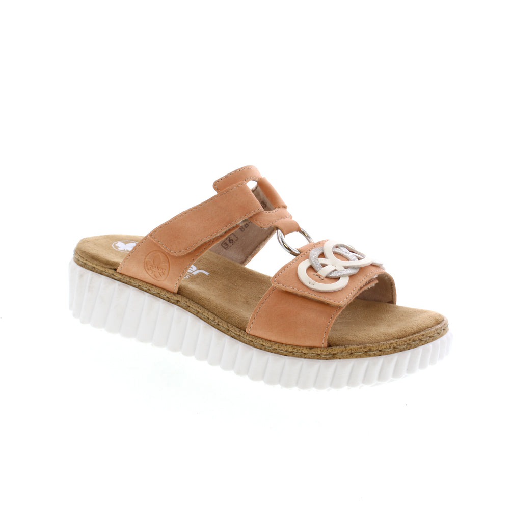 This stylish&nbsp;<span data-mce-fragment="1">63294-38</span> slip-on sandal from Rieker showcases beautiful circular accents, convenient hook-and-loop velcro straps, and a comfortable footbed ideal for both fashion and function.