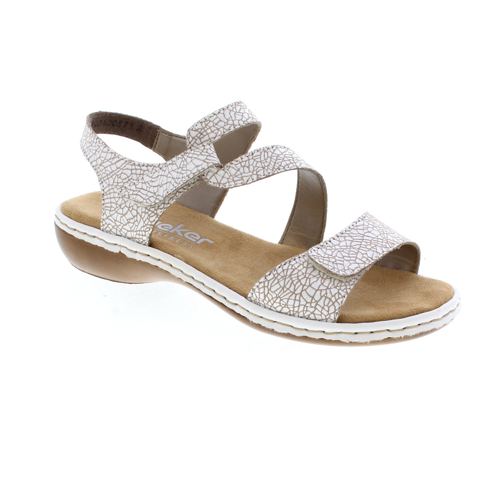 Experience effortless comfort with the Rieker 659C7-81 white strap sandal. Crafted from premium leather with stitchdown construction. The velcro closure gets you ready in seconds, while the lightweight foam midsole and wedge heel make every step a breeze. Microfiber footbed, round toe, and rubber outsole complete this casual essential. True to size and built for all-day wear.