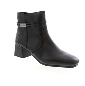 Experience style and comfort with Rieker 70973-00 ankle boots in sleek black leather. The side zipper and shock-absorbing, lightweight sole with block heel make them easy to wear all day. The decorative strap adds a touch of flair while the extra soft cover sole ensures ultimate comfort. Perfect for everyday wear.