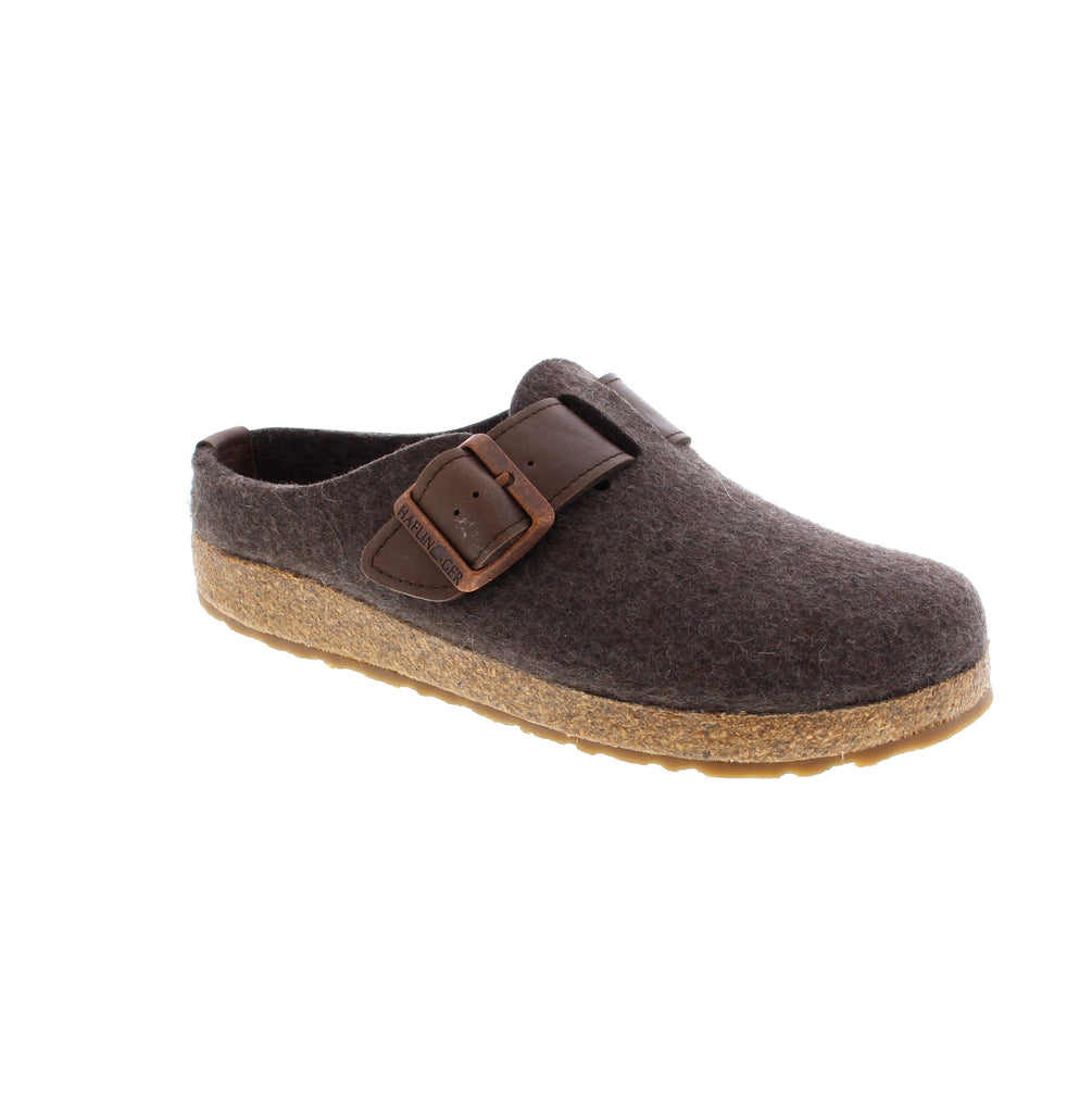 Experience exceptional comfort and timeless style with the Haflinger Women's GZB Buckle in Smokey Brown. Crafted with a 100% wool felt upper, this slipper ensures natural breathability and durability while maintaining a consistent temperature for your feet. Ideal for both indoor and outdoor use, it combines cozy softness with practical performance, making it a reliable choice for all-day wear. The buckle detail adds subtle sophistication to a classic, comfortable design.