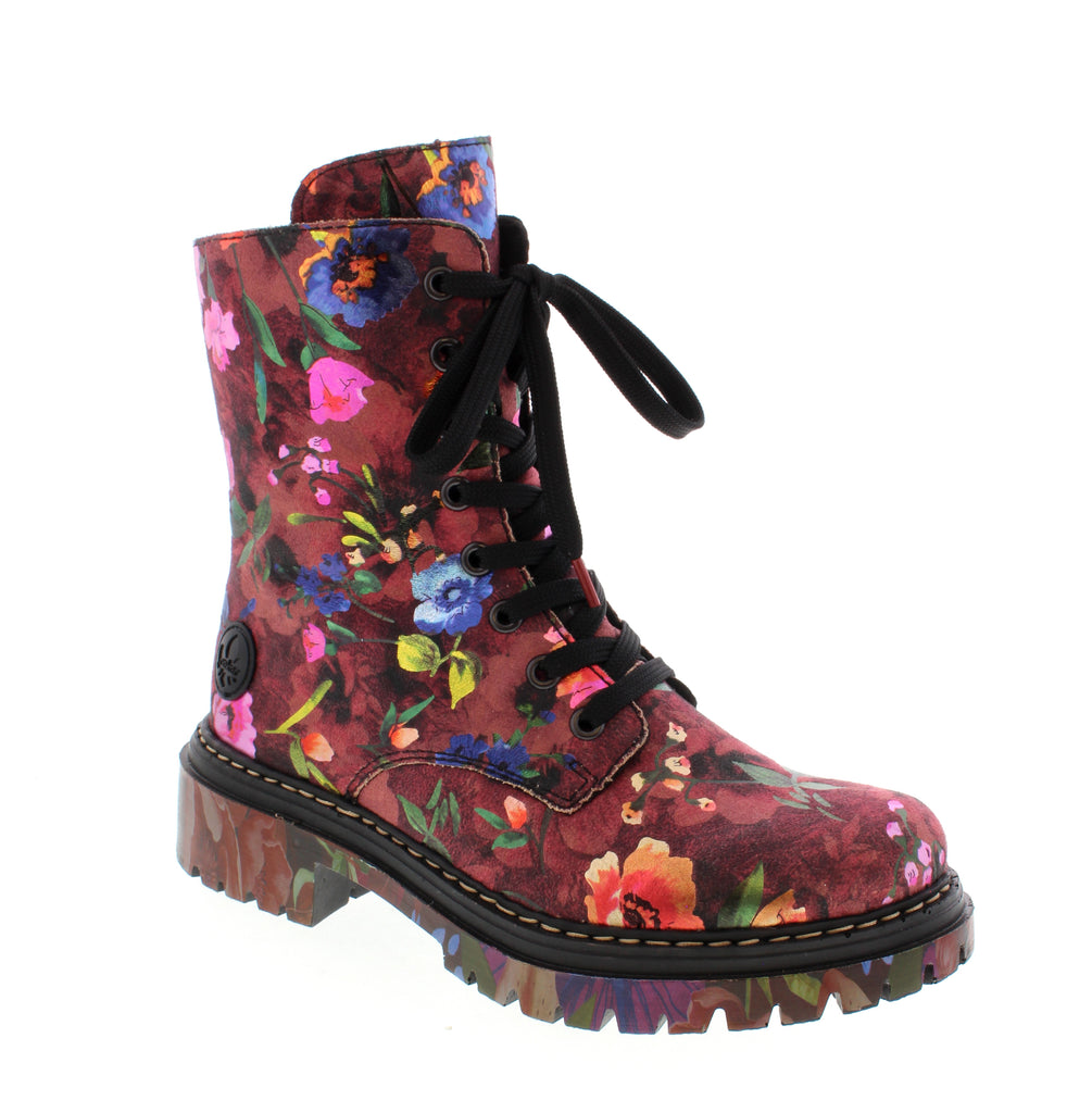 Edgy and versatile, the Rieker 72627-92 Multi combines contemporary style with everyday comfort. This casual combat boot features a vegan leather upper with faux fur lining for warmth and a microfiber footbed that cushions every step.