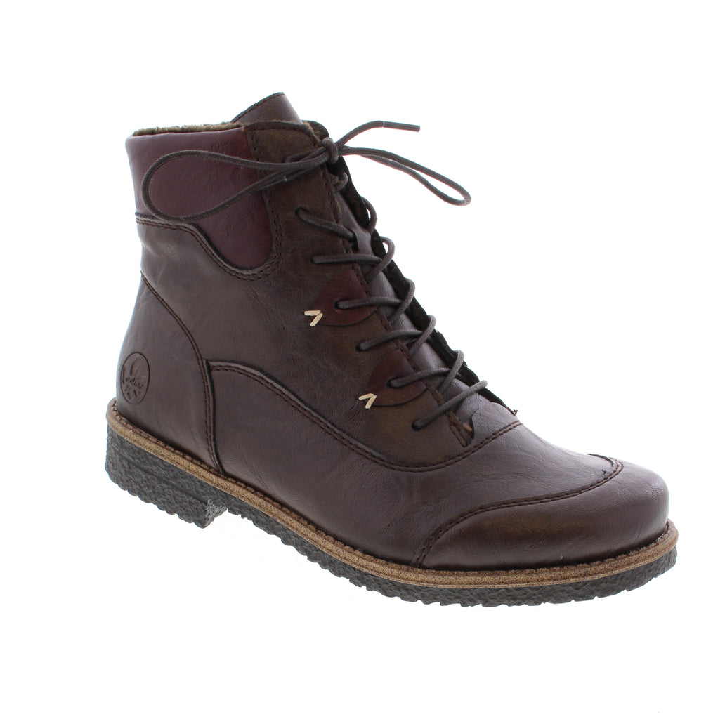 Rieker brings European craftsmanship to everyday comfort with this versatile brown bootie. The perfect blend of style and wearability for casual occasions. Designed for those who refuse to compromise between elegance and practicality, this bootie features a supple leather upper paired with cozy faux fur lining to keep your feet warm through the seasons.
