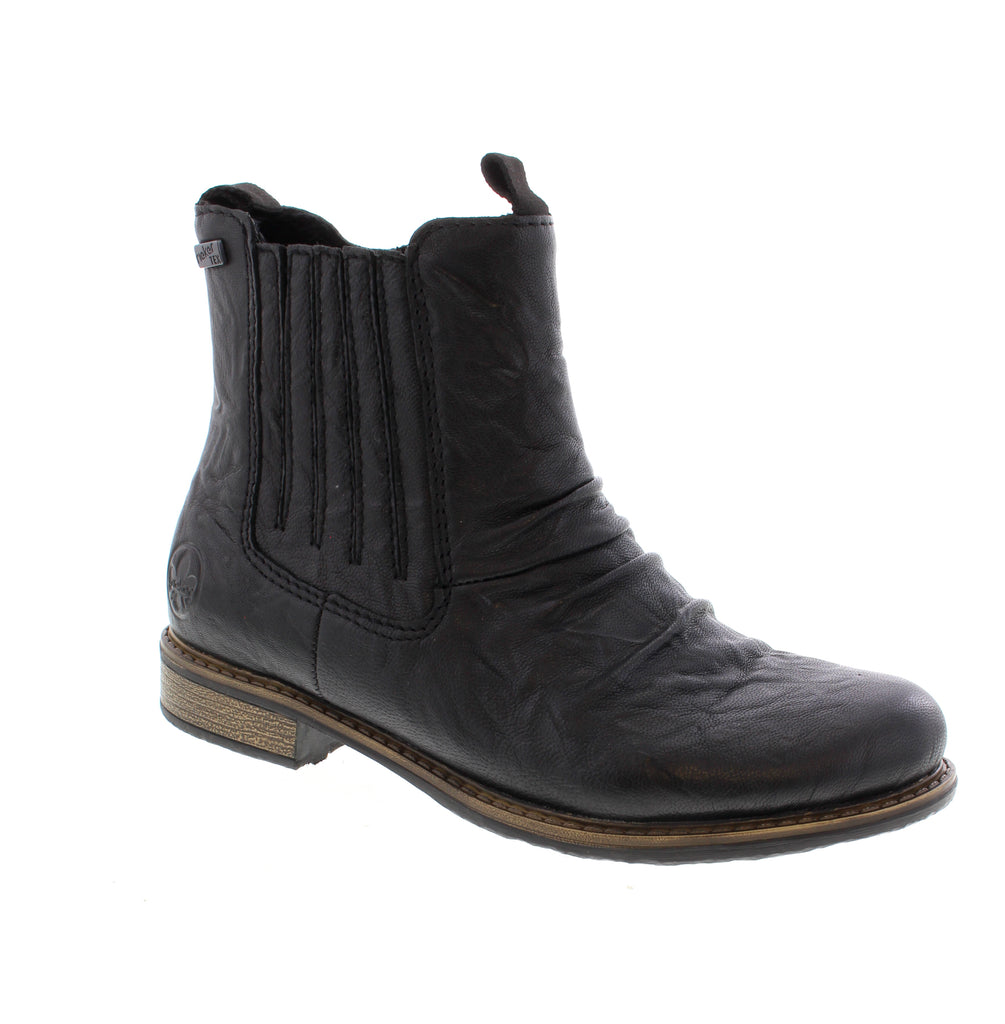 Effortless elegance meets everyday comfort in this Rieker Chelsea boot. The leather upper and faux fur lining deliver warmth and sophistication, while the removable microfiber footbed and foam midsole provide all-day support.