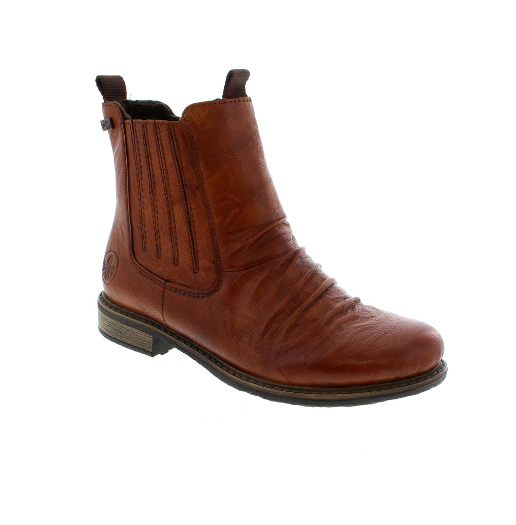 Experience the perfect blend of style and comfort with these Rieker Chelsea boots. Crafted from smooth leather, they feature both a zipper and an elastic insert for effortless wear. The grippy sole ensures secure footing on various surfaces, while the padded, removable insole provides comfort all day. With extra width for added comfort and a water-repellent RiekerTEX membrane to keep your feet dry, these boots are ready for any weather. Stylish, practical, and designed to become your new favorite!