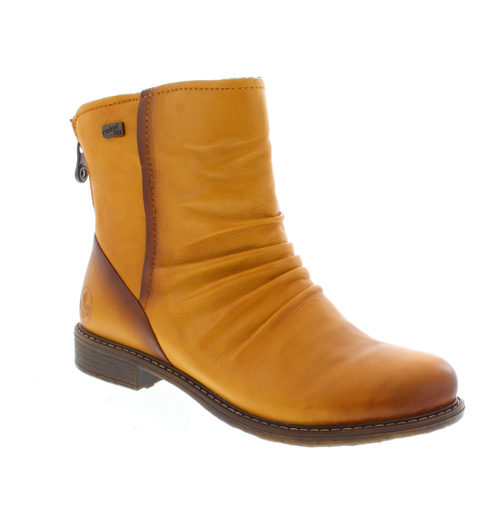 Rieker's 74859-68 brings warmth and style to your winter wardrobe with its insulated leather upper and cozy fleece lining. This ankle boot features a water-resistant finish, removable microfiber insole, and supportive foam midsole for all-day comfort in cold weather. Designed with an almond toe and block heel, it pairs effortlessly with casual outfits.