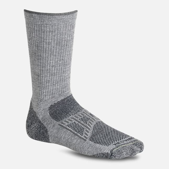 The Red Wing Work Light Weight Crew Sock in Grey is the perfect companion for any work environment. With its temperature-regulating and moisture-wicking properties, these socks keep feet comfortable in any weather. Made with ultra-cozy material, they also resist odors for long-lasting wear.