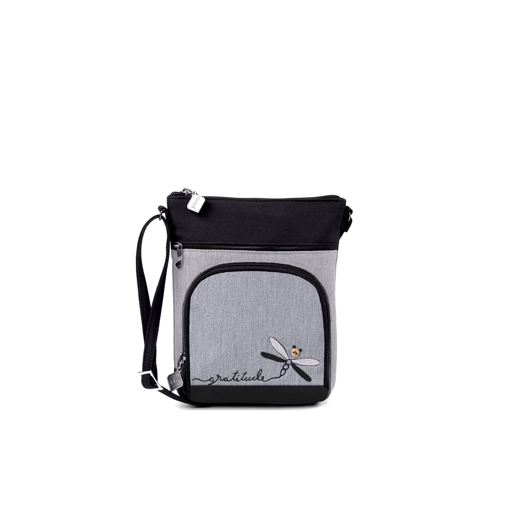 Stay organized with Jak's Grab and Go Pouch. This walking pouch features a convenient organizer pocket for storing cards, cash, and personal items. The adjustable shoulder strap makes it perfect for everyday use. Add a touch of style with the embroidered "gratitude" and dragonfly.