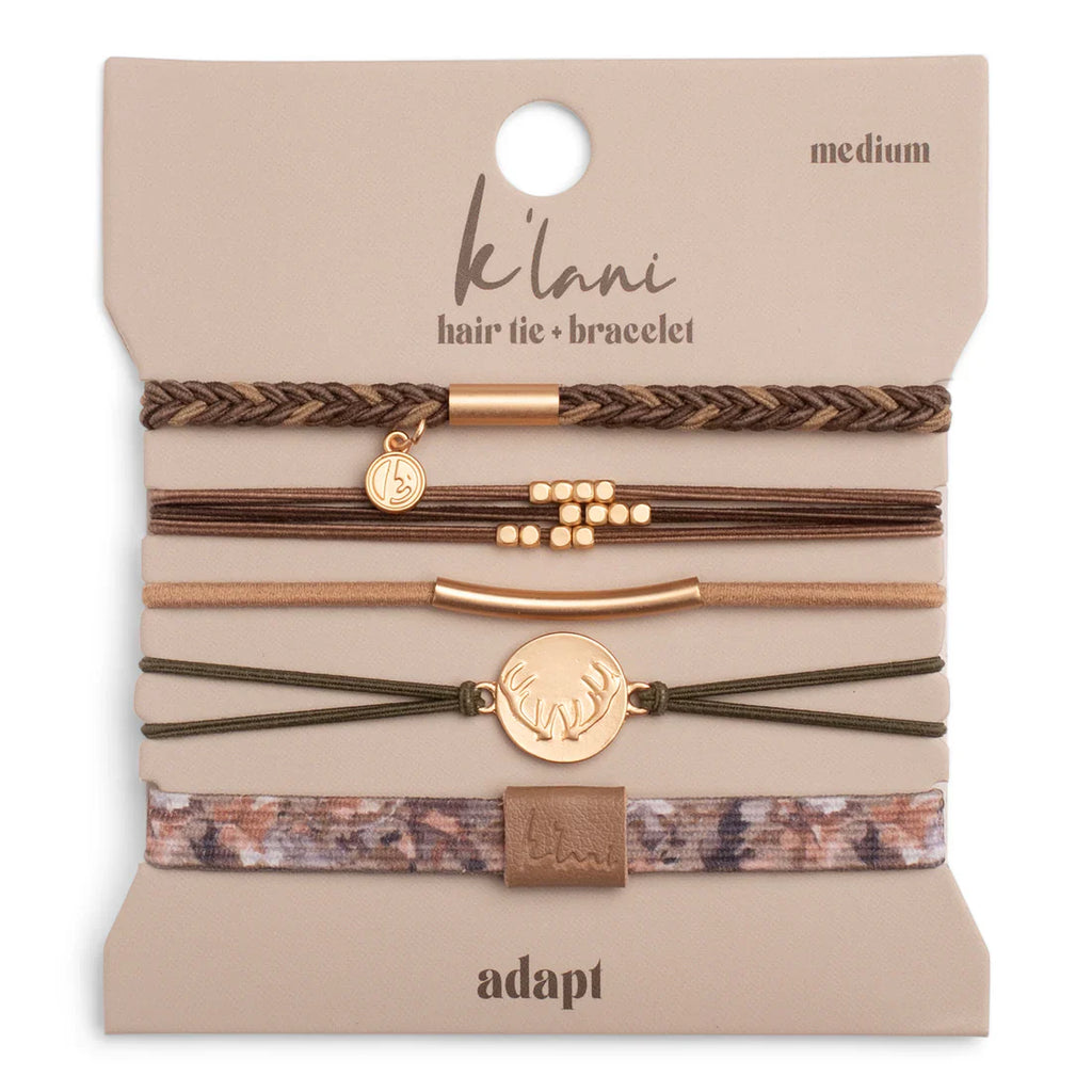 The K'lani Adapt hair tie/bracelet set comes with 5 pieces in earthy tones.N Accented with gold charms, these remind you to stay grounded and ready for whatever your day brings