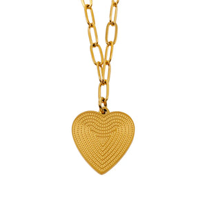 Discover modern elegance with our Hackney Nine Alara - Gold Paper Clip Chain Necklace. Meticulously crafted, this unique accessory features interconnected paper clips for a touch of contemporary flair. The intricate patterned heart charm at the center not only adds grace and style but also represents connectivity and unity. A must-have for any jewelry collection.