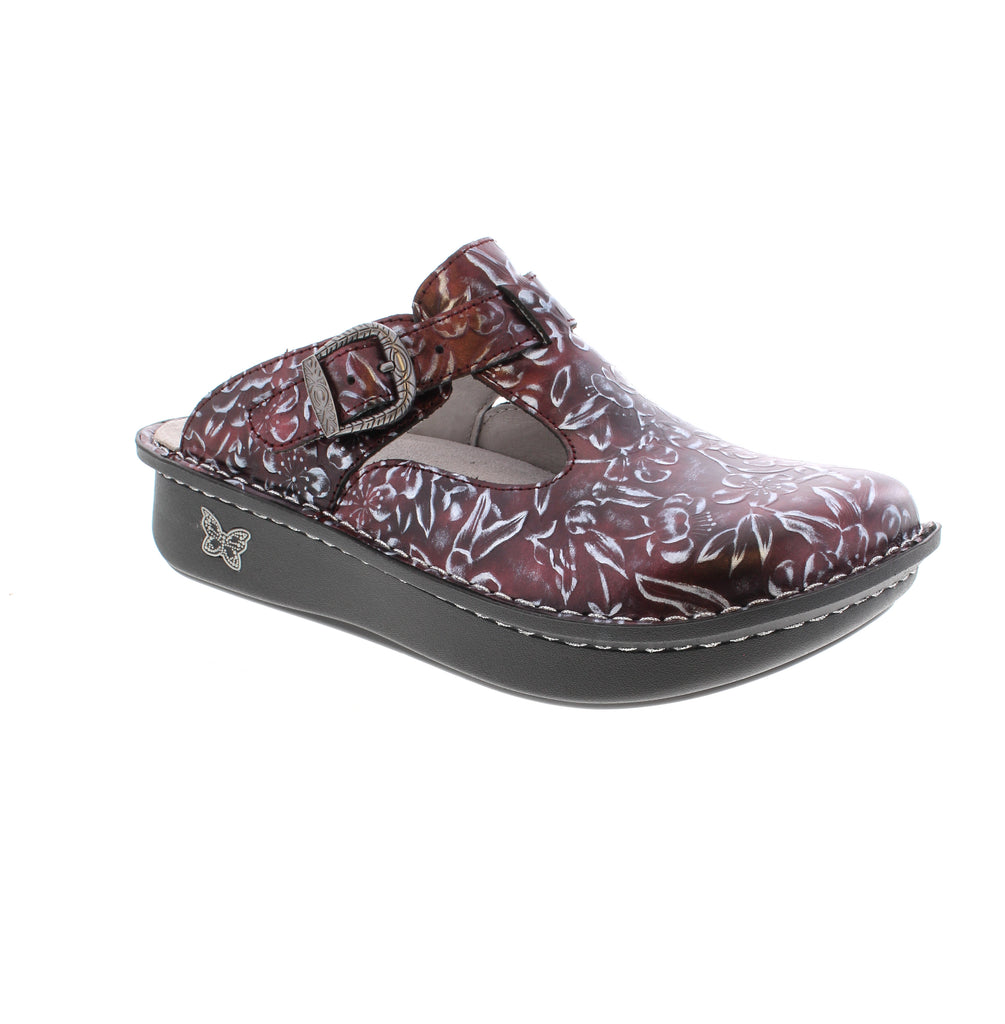 The Alegria Classic in Rosewood showcases a refined floral embossed leather upper paired with an adjustable side buckle for a custom fit. Its rocker outsole supports a natural walking motion, reducing fatigue throughout the day. Designed with a removable footbed, the clog easily adapts from medium to wide width, delivering both style and functionality for all-day wear.