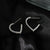 Elevate your style game with the Hackney Nine Anjar White Gold Heart Shaped Hoop Earrings. Embedded with sparkling zirconia gemstones, these earrings exude understated glamour for any occasion. As a perfect gift that symbolizes grace and sophistication, they make a great choice for birthdays, anniversaries, or any special celebration.