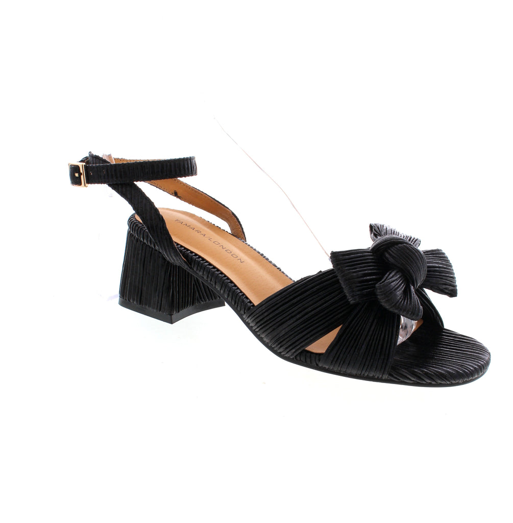 The Tamara London Auger is a stylish heel that will turn heads with its bow detailing. It offers an adjustable backstrap for security and a block heel for a touch of class. Perfect for any occasion, these heels will elevate your look and make a statement.