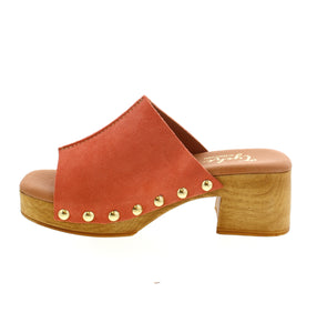 Step back in time with the Tyche Bella clogs. These 70's-inspired clogs feature suede uppers, an open-toe design, and a well-cushioned footbed for ultimate support and comfort. Crafted in Turkey with a molded wood platform, these clogs mix retro fashion and modern comfort.