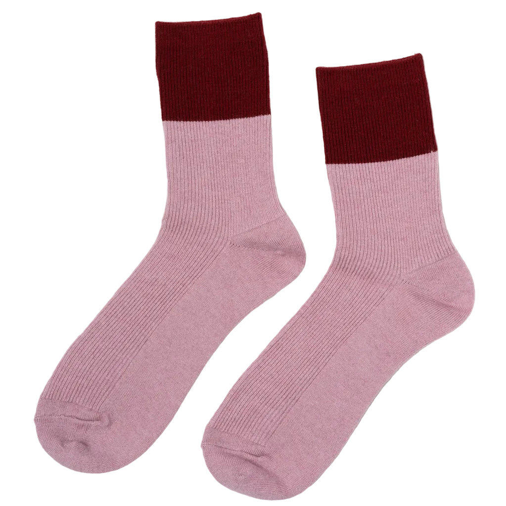 Luxuriously soft Chalet Socks crafted from 85% Australian merino wool, 12% polyester, and 3% spandex. These premium socks feature natural moisture-wicking and temperature-regulating properties, keeping your feet comfortable year-round. The thick, velvety construction pairs with a refined finish and striking berry and garnet colour-blocking for a sophisticated everyday essential. Breathable merino wool adapts to any season warm when temperatures drop, cool when they rise.