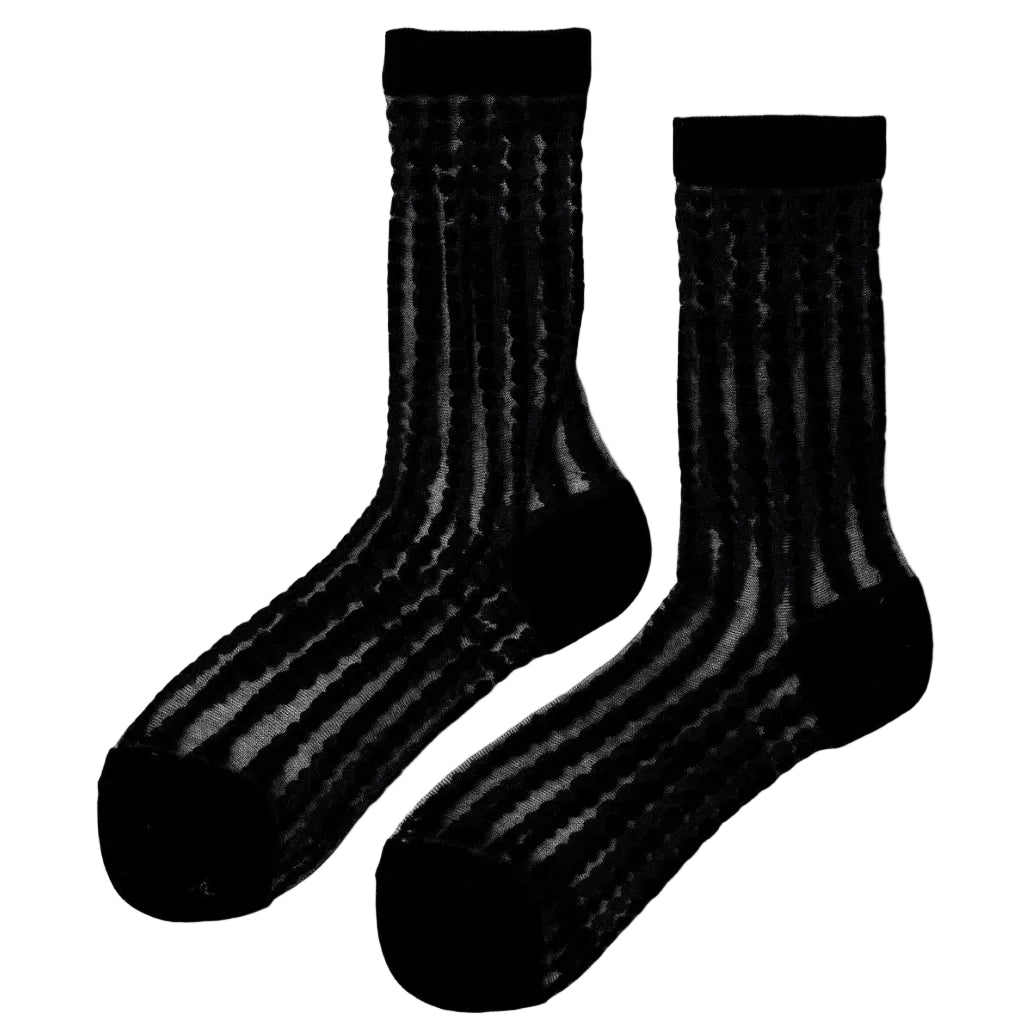 Elegant and unique, these sheer crew socks feature delicate bubble patterns in varying sizes that evoke the sparkle of champagne. The refined design elevates everyday wear with a touch of luxury. Choose from timeless Black, soft Ivory, or rich Merlot to complement your personal style. Hand wash or use a delicate cycle to maintain their beauty. Composition: 43% Polyester, 37% Cotton, 18% Nylon, 2% Spandex.