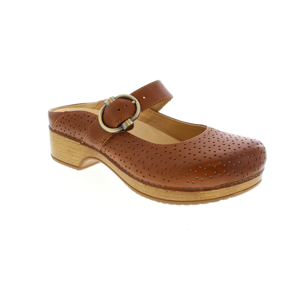 Step into effortless style with the Dansko Blaire, a versatile clog that transitions seamlessly from office to weekend. The adjustable antique brass buckle strap delivers a personalized fit, while perforated leather detailing adds visual depth and breathability to the classic Mary Jane silhouette.