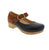 The Dansko Bonny Mary Jane blends timeless design with everyday comfort. This versatile clog features smooth black leather and brushed brown suede, paired with a classic adjustable strap and warm gold hardware. The cushioned EVA footbed keeps you comfortable all day, whether at work or out and about