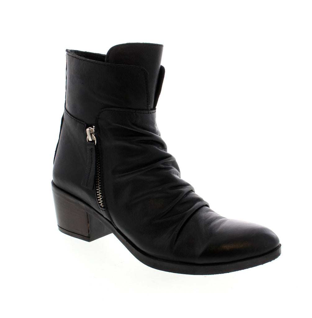 Elevate your style with the Bueno Colbie asymmetrical ankle boot. This sleek and supportive must-have adds a stylish edge to any outfit. With its chic design and comfortable fit, your wardrobe will be the focal point of conversation!&nbsp;