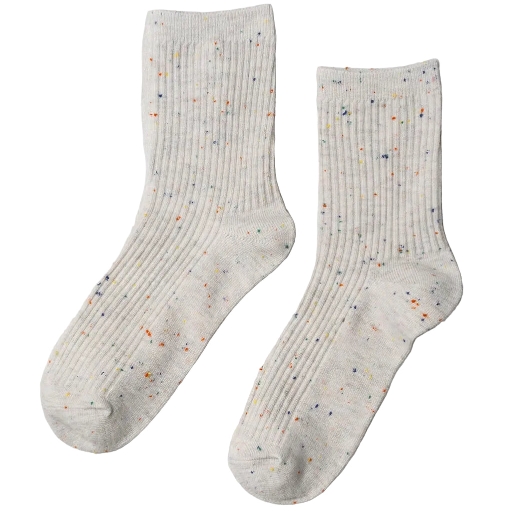Step up your sock game with Unified Confetti Socks in Coal. These playful yet refined socks feature a signature confetti effect created by vibrant multi-coloured yarns woven throughout a premium cotton-blend base. Made from 75% cotton and 25% spandex, the fabric delivers breathability and stretch for all-day comfort. The fine rib construction hugs your foot with gentle support, keeping you comfortable from morning to night. 