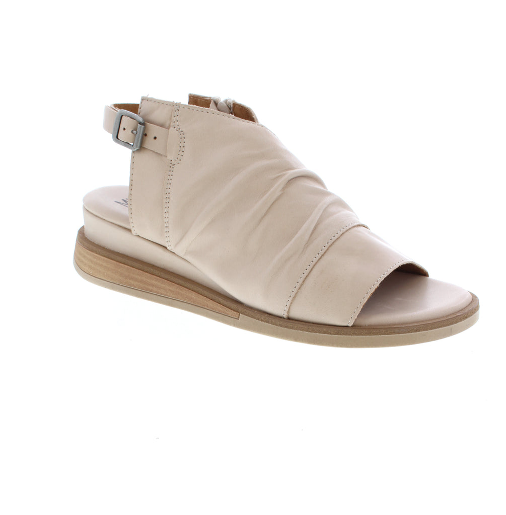 Master the art of effortless style with the Miz Mooz Conor sandal. Featuring simple rouching on the uppers, a slight wedge with wooden detail in the sole, and a functional buckle to keep your foot in place, this sandal is perfect for those who appreciate a minimalist approach to fashion. Its understated design allows for easy styling and pairs well with any outfit. Elevate your summer wardrobe with the classic and timeless Conor sandal.