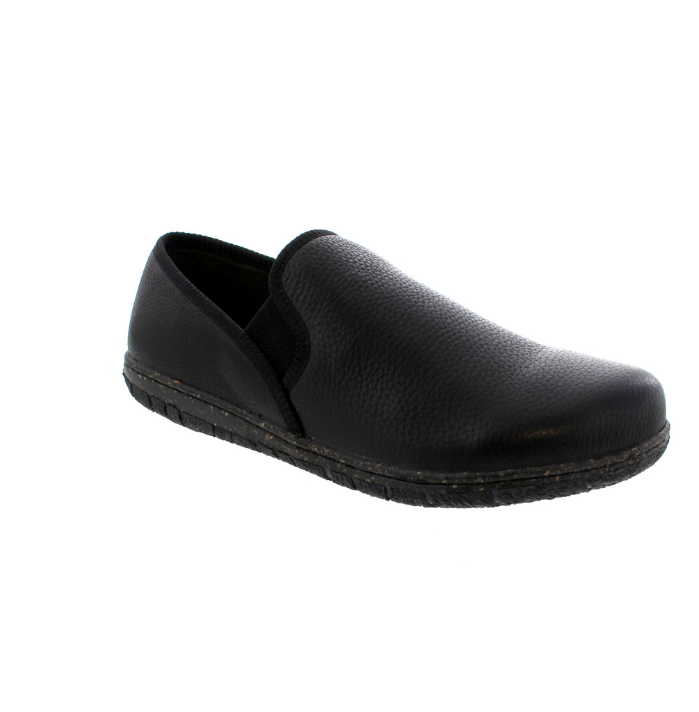 Treat your feet like royalty with the Foamtreads Conrad slipper in Black. Crafted from rich tumbled leather, these slippers offer a sophisticated look combined with lasting durability. The memory foam insole cushions every step, providing plush comfort that helps you unwind after a long day. Whether you're lounging at home or taking a quick stroll outside, these slippers deliver warmth and support. Slip into the Conrad and enjoy a luxurious experience that makes relaxing feel like a grand occasion.