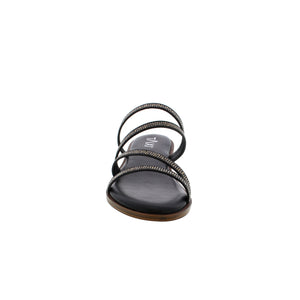 The Taxi Cora sandal is the perfect combination of fashion and comfort. The sleek black straps are adorned with sparkling rhinestones and the soft sock padding provides cushioned support. You'll love the flexibility of the outsole, allowing for all-day wear. Step into style with Taxi.