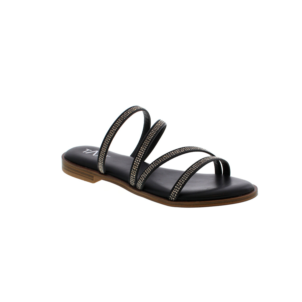 The Taxi Cora sandal is the perfect combination of fashion and comfort. The sleek black straps are adorned with sparkling rhinestones and the soft sock padding provides cushioned support. You'll love the flexibility of the outsole, allowing for all-day wear. Step into style with Taxi.