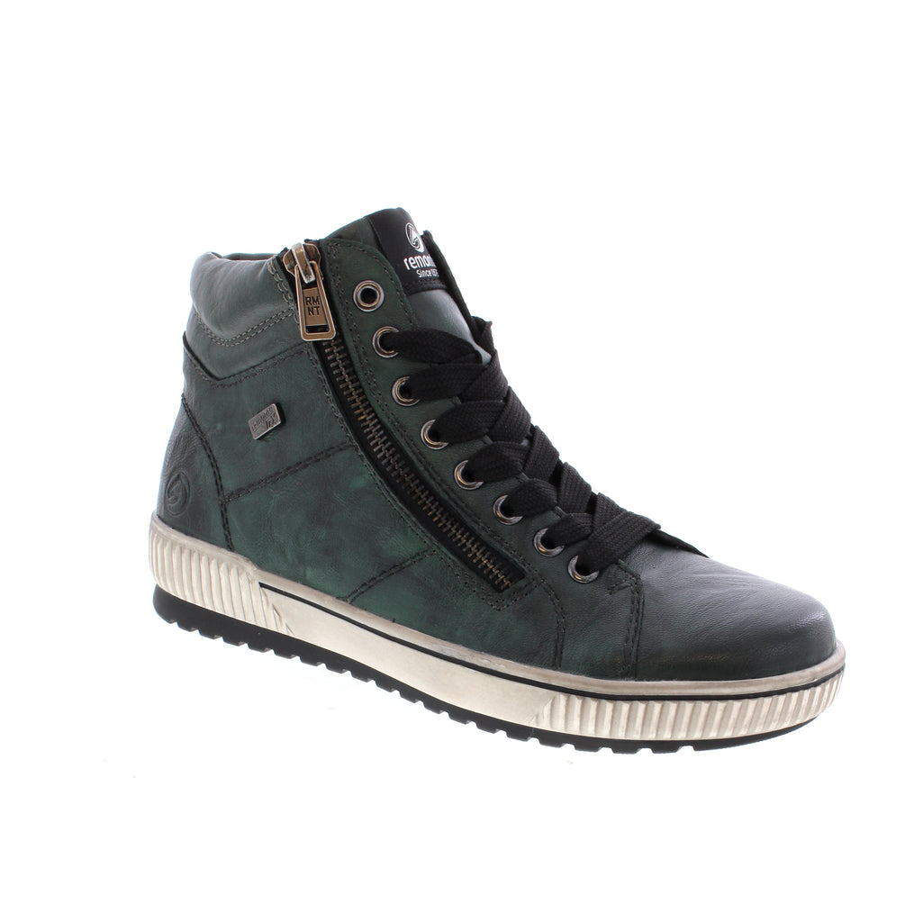Elevate your everyday style with the Remonte D0772-54 in Teal, a versatile ankle boot that blends comfort with contemporary design. Crafted with a leather upper and water-resistant finish, this boot features a supportive foam midsole and microfiber footbed for all-day wearability. Designed with a flatform heel and round toe silhouette, it delivers a modern look perfect for casual occasions. The lace-up entry ensures a secure fit.