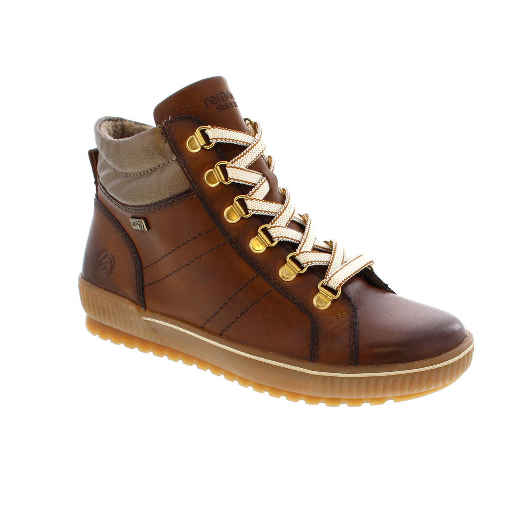 These Remonte D0781-24 lace-up boots combine style and comfort effortlessly. Crafted from smooth leather, they feature both laces and a zipper for easy wear, plus interchangeable laces for a personalized look. The padded, removable insole and flexible sole provide cushioning and stability on any surface. Designed with comfort width, they offer extra room for natural foot movement. Thanks to remonteTEX technology, these boots are water-repellent and wind-resistant.