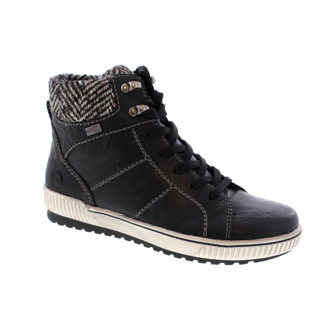 Remonte D0784-03 brings timeless elegance to your everyday wardrobe with a sleek black leather design. This insulated ankle boot combines comfort and style, featuring a leather upper, felt lining, and a supportive foam midsole perfect for casual wear. Crafted with a removable microfiber footbed and rubber outsole for durability, this boot fits true to size with an average width and instep. The flatform heel and round toe silhouette offer a modern look, while the lace-up entry ensures a secure fit.&nbsp;