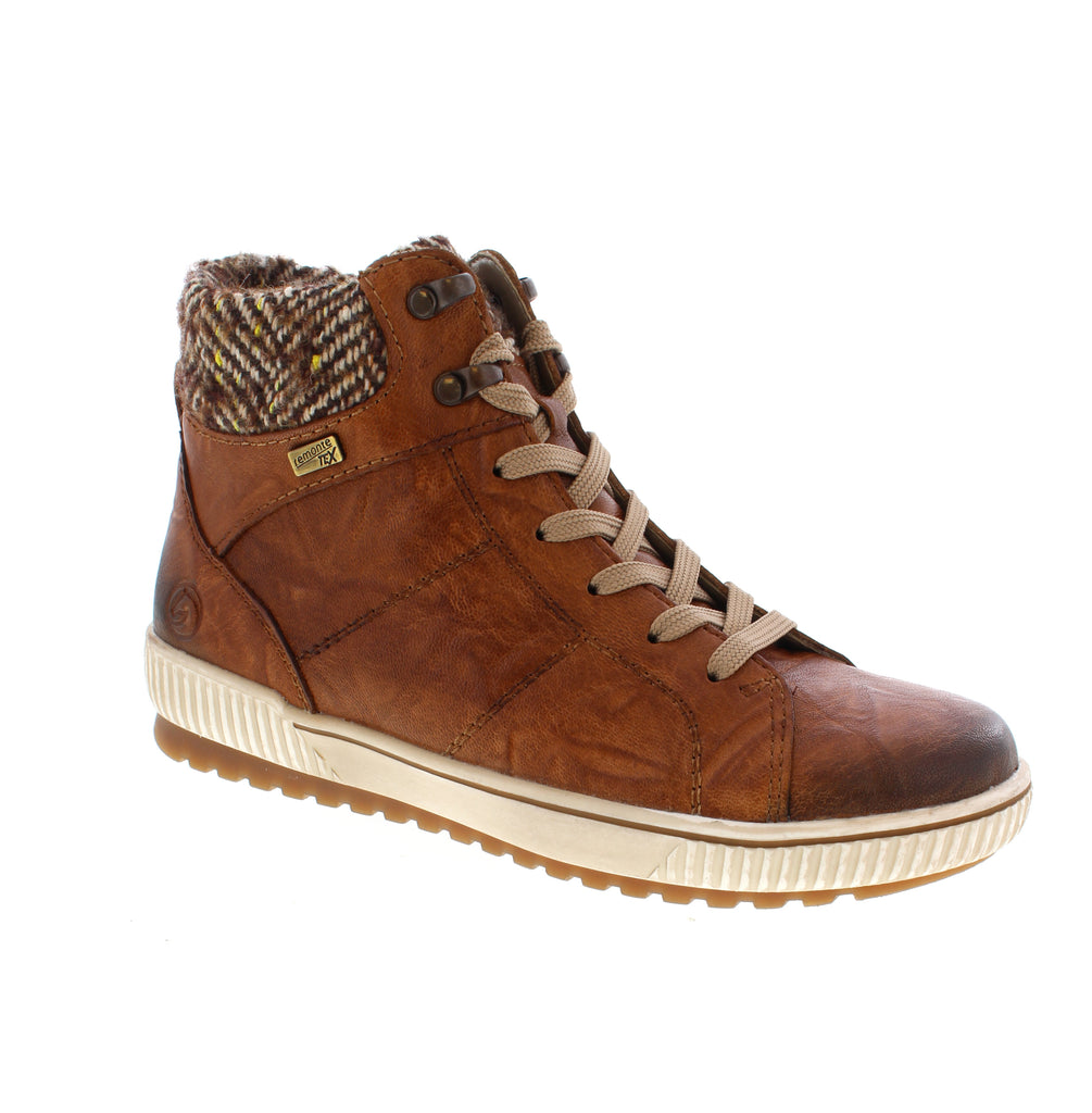 Remonte brings European craftsmanship to everyday comfort with the D0784-22, a versatile tan leather boot designed for casual outings and cooler seasons. Built with a water-resistant leather upper, felt lining, and supportive foam midsole, this ankle boot keeps your feet warm and dry while maintaining a sleek, understated look. Featuring a removable microfiber footbed and orthotic-friendly design.