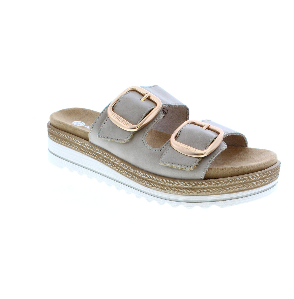 The Remonte D0Q66-62 is a neutral beige slide sandal crafted from soft leather with a white sole. This casual summer essential features a low flatform heel, velcro closure, and removable microfiber insole for personalized comfort. The foam midsole cushions every step, while orthotic-friendly design supports narrow-to-medium feet.
