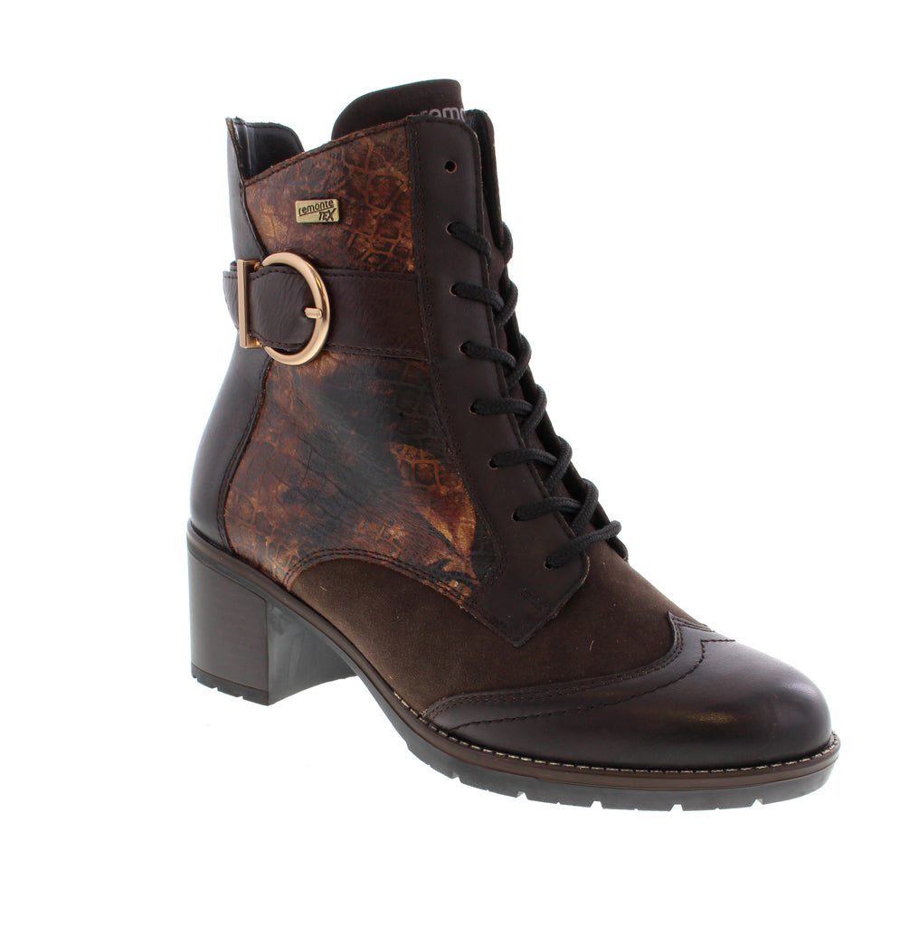 Experience unmatched comfort and style with these brown Remonte D2A77-25 lace-up boots crafted from soft suede leather. The combination of laces and a zipper ensures easy wear and a secure fit. Featuring a flexible, grippy sole with a block heel and a padded, removable insole, these boots provide lasting comfort with every step. Thanks to remonteTEX technology, they are water-repellent, making them perfect for any weather while keeping you looking effortlessly chic.