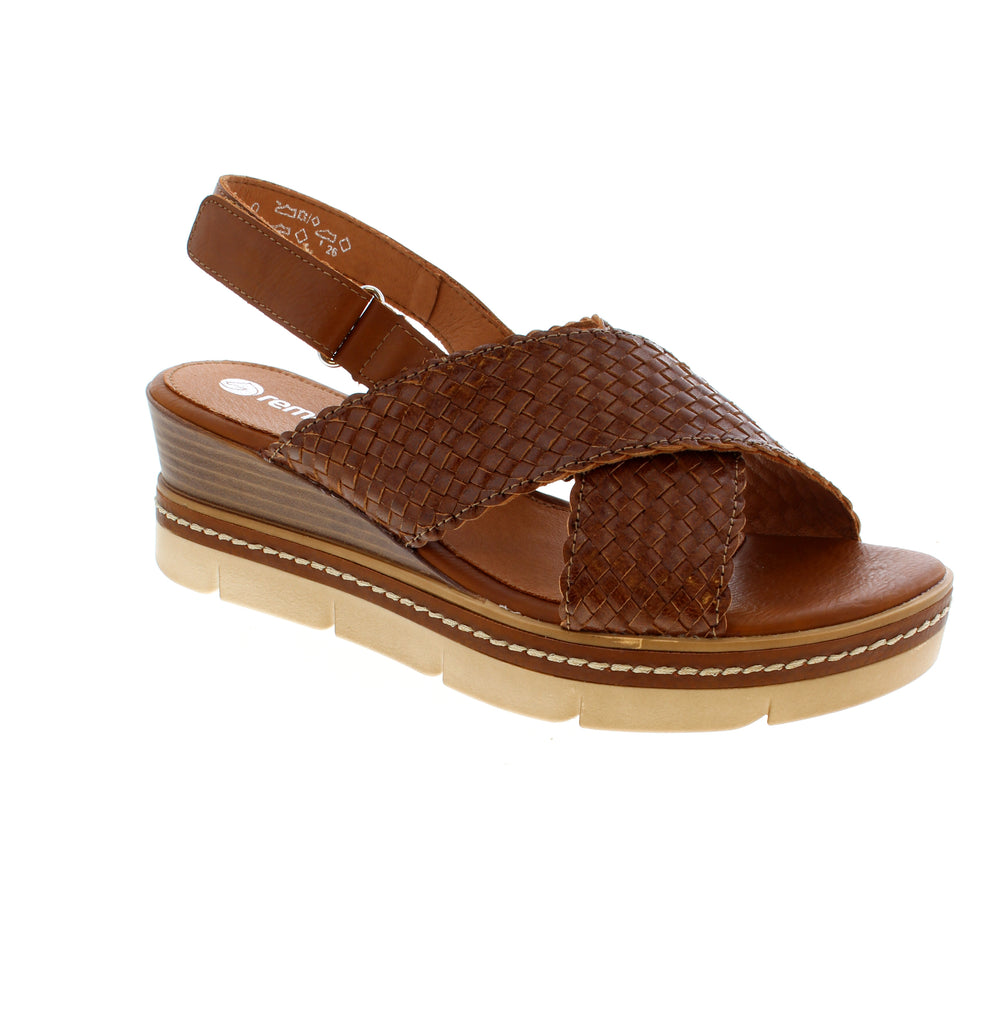 The Remonte D2L59-24 is a brown slingback sandal with a woven leather upper and round toe. Its elasticized upper and velcro closure offer easy adjustability, while the wedge heel and foam midsole keep you comfortable. The man-made leather footbed provides cushioning support.