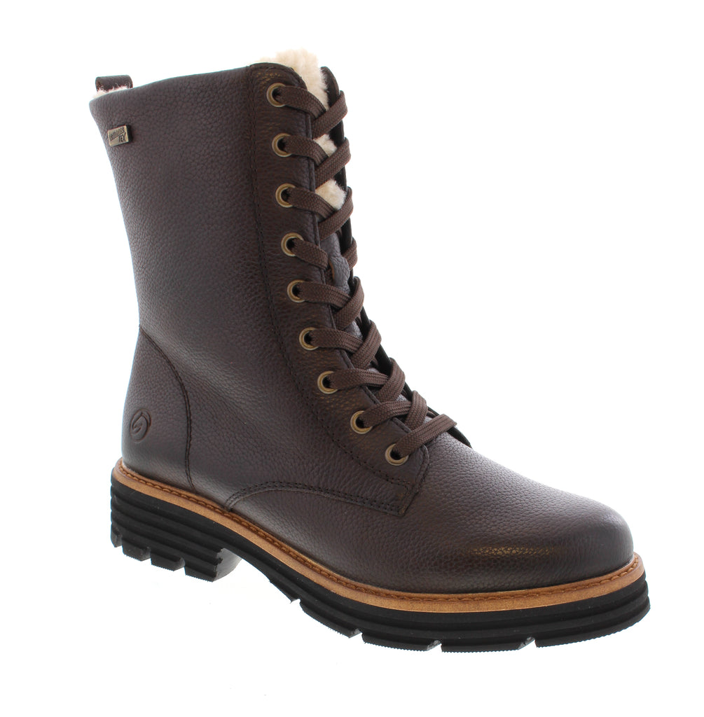 Remonte D3A73-25 in rich brown leather combines comfort and style for everyday wear. This versatile ankle boot features a water-resistant leather upper, felt lining, and a supportive foam midsole—perfect for casual outings and outdoor adventures. Leather upper with water-resistant protection keeps your feet dry. Felt lining and insulation provide warmth during cooler months. Microfiber footbed and foam midsole deliver cushioning and support. Rubber outsole offers reliable traction. 