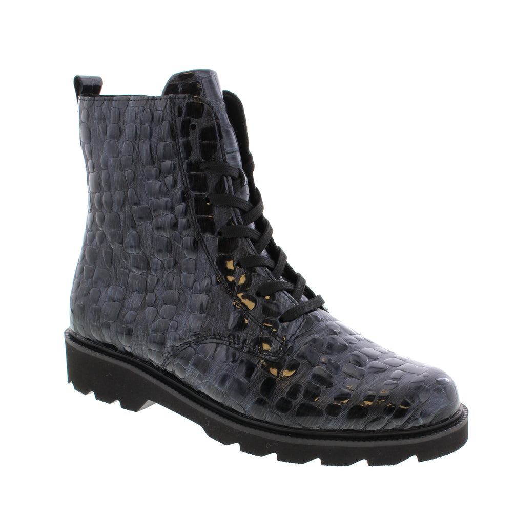 Elevate your everyday style with the Remonte D3S72-14, a navy multi ankle boot that seamlessly blends comfort and sophistication. Crafted with a leather upper and microfiber lining, this versatile boot features a removable insole and foam midsole for all-day support. Lace-up entry and a rubber outsole provide secure fit and reliable traction. The block heel and round toe silhouette offer a timeless look perfect for casual occasions.