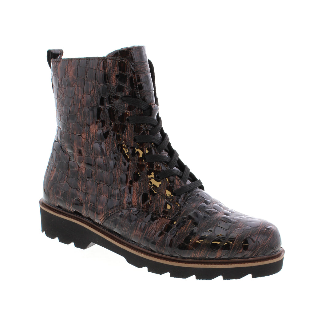 Remonte brings European craftsmanship to everyday comfort with the D3S72-25, a versatile brown multi ankle boot designed for casual wear. The leather upper and removable insole provide all-day support, while the lace-up entry and block heel offer easy styling and stability.