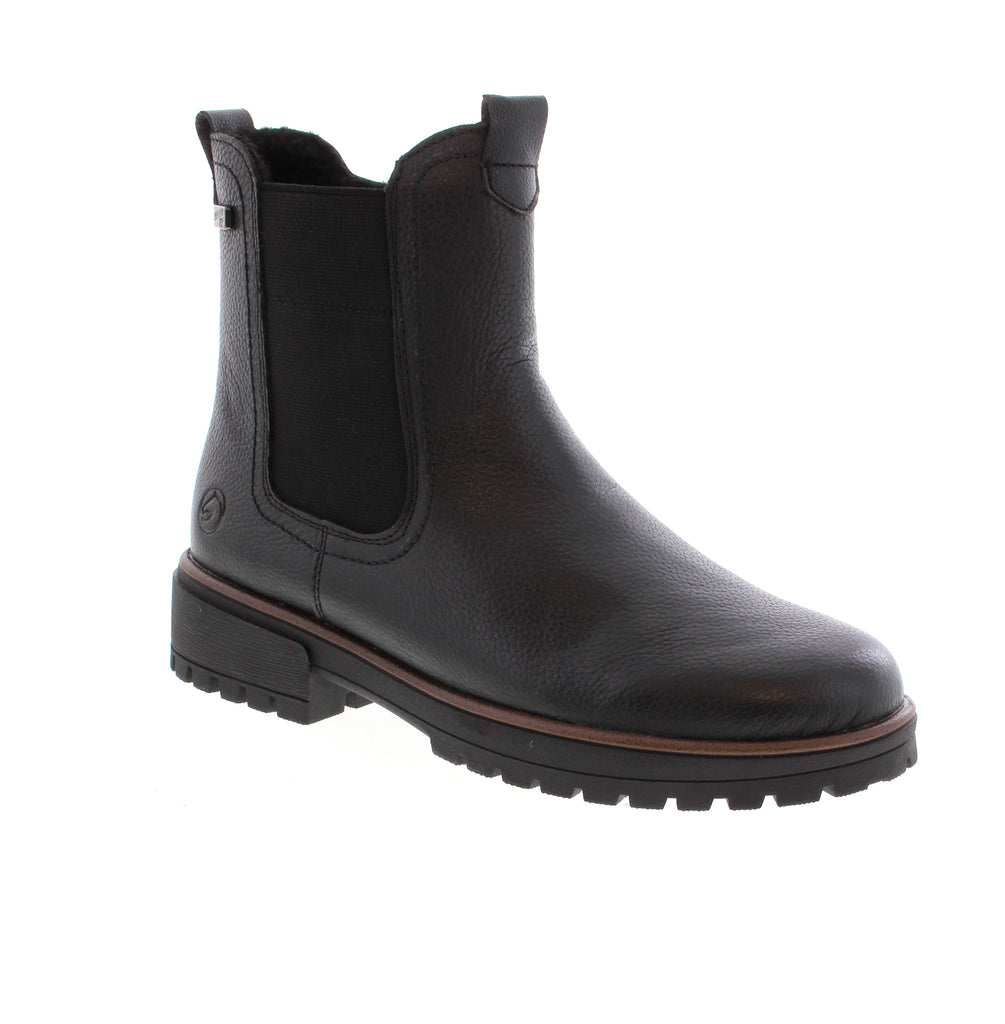 Remonte D3W73-00 Chelsea Boot in Black combines comfort with timeless style. This water-resistant leather ankle boot features a felt lining, foam midsole, and removable insole for all-day support. The side zip entry makes it easy to slip on, while the block heel and round toe deliver a classic look perfect for casual winter wear. Fits true to size with an average width and instep.