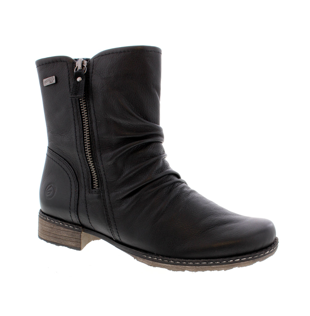 Elegant ankle boot crafted from premium leather with water-resistant protection. Features a comfortable microfiber lining and footbed, paired with a supportive foam midsole and durable rubber outsole. The double side zip entry makes it easy to slip on and off, while the understated almond toe and block heel deliver everyday sophistication.