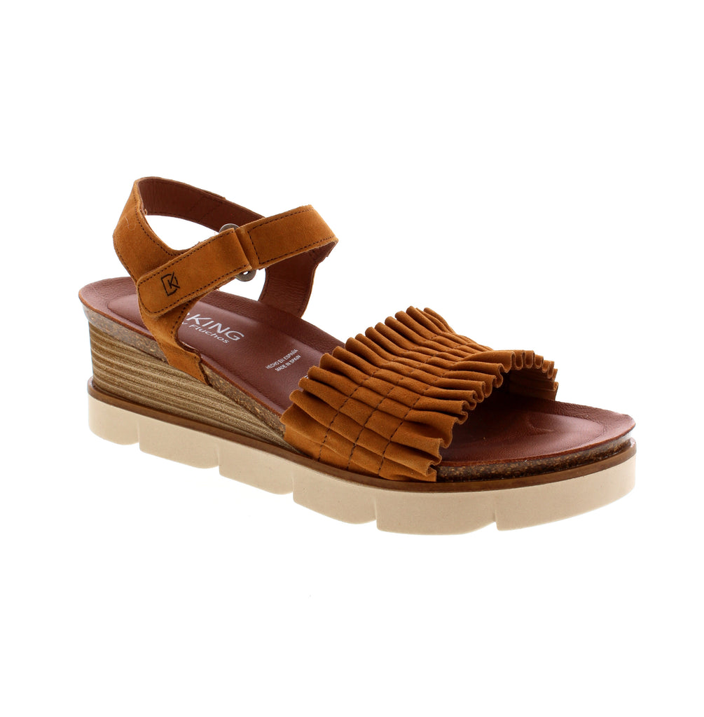 Ladies suede wedge heel sandal in a tan color, with bunch detailing at toe strap.