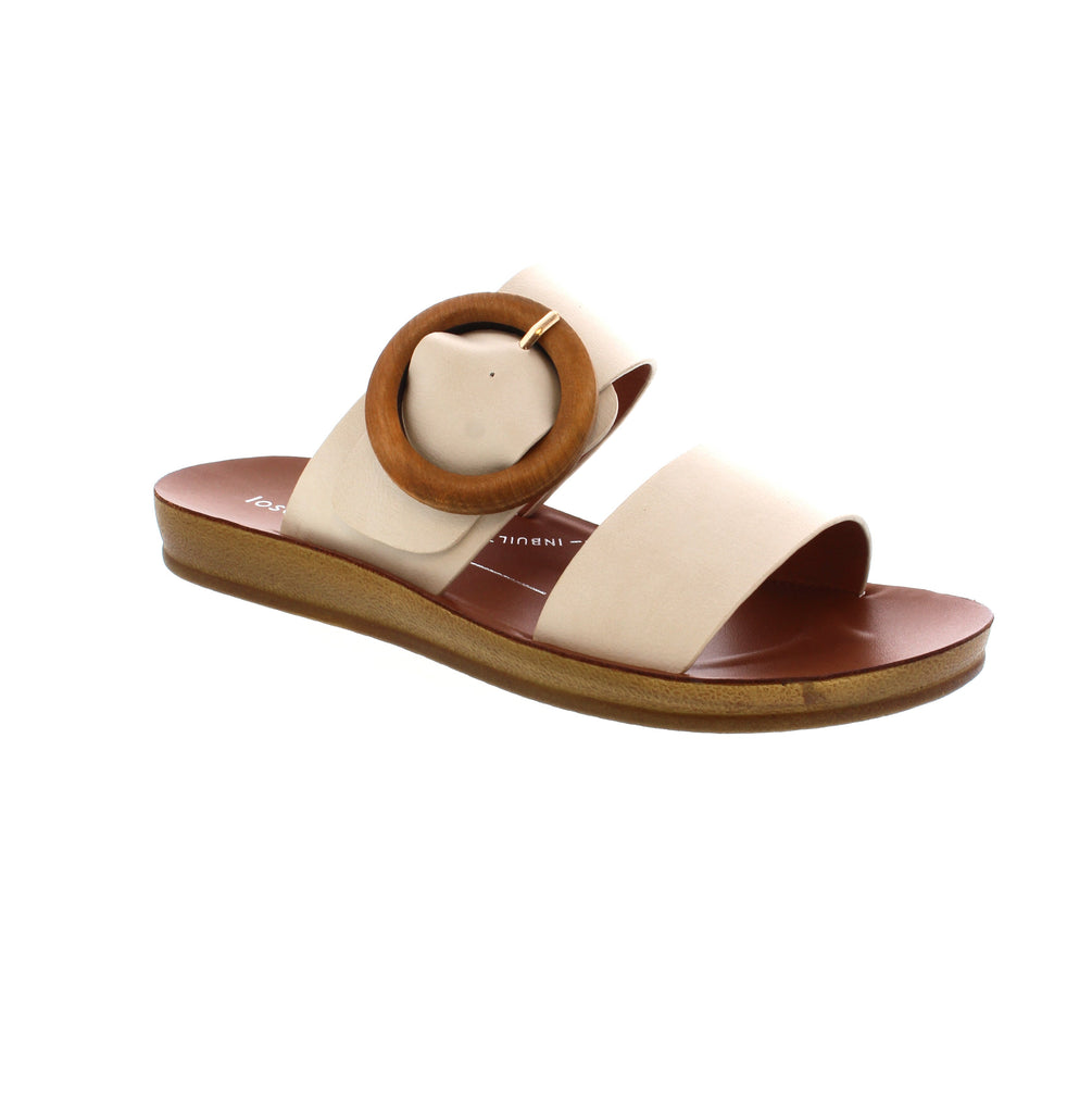 Elevate your summer look with the Los Cabos Damani slides! Featuring a wooden buckle and adjustable strap, these slides offer a unique and stylish touch to any outfit. Not only are they fashionable, but they also provide all-day comfort. Slip into Damani and enjoy the best of both worlds - fashion and comfort.